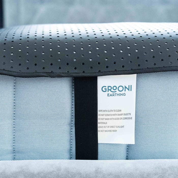 Grooni grounding mat laid on a bed