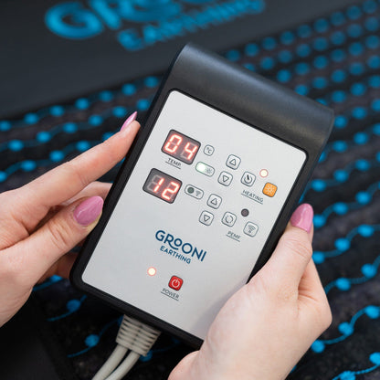 PEMF control unit detail showing buttons and functionalities