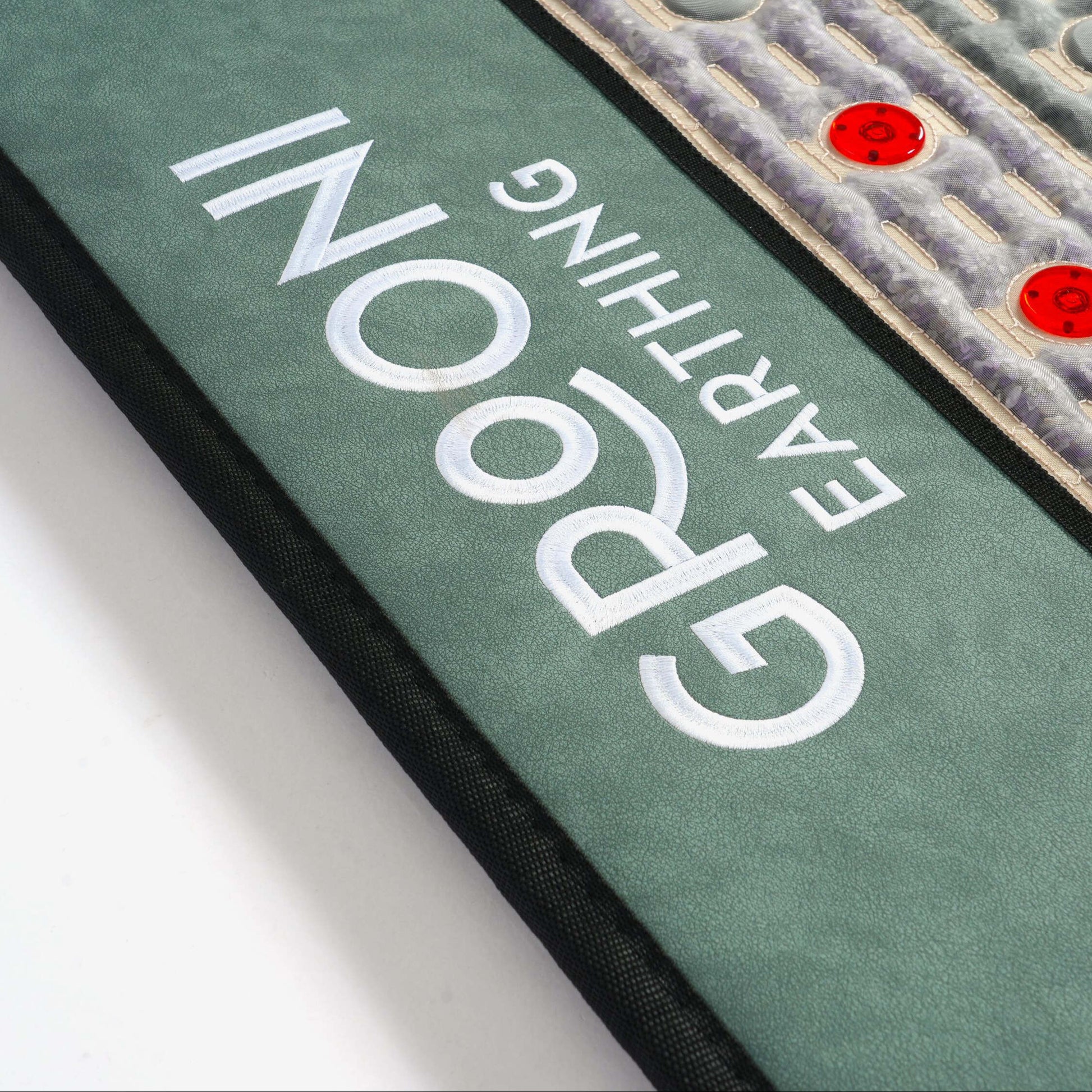 PEMF Infrared photon mat showcasing grooni earthing logo