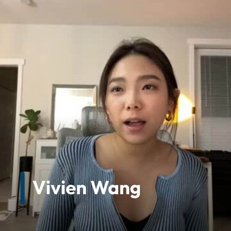 Woman in a blue striped shirt with 'Vivien Wang' text in a room.