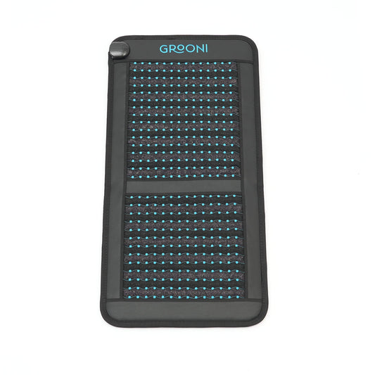 Black chair pemf mat with grid pattern and 'Grooni' branding on a white background