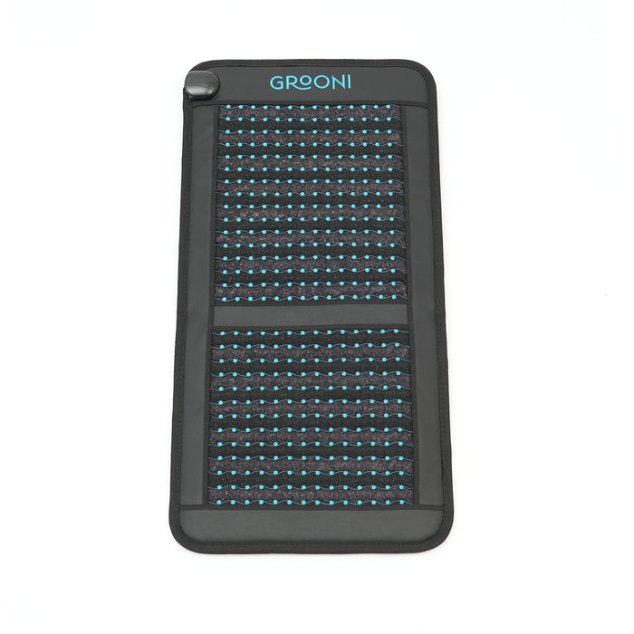 Black chair pemf mat with grid pattern and 'Grooni' branding on a white background