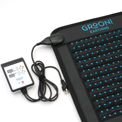 Grooni Earthling mat with digital controller on a white background