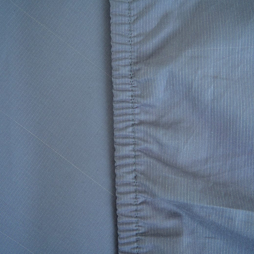 Grey grounding sheet texture close up